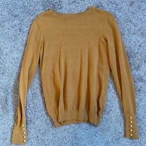 Mustard yellow sweater with pearl sleeve details